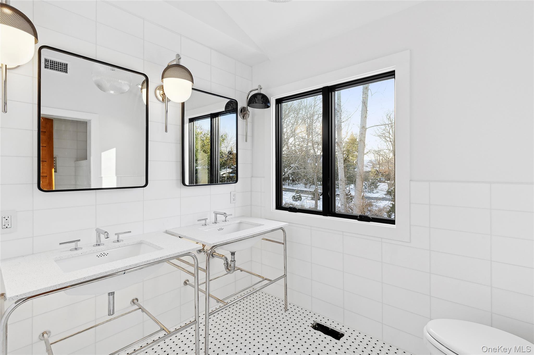 221 Redwood Road Sag Harbor, NY 11963 - Photo 13 of 19 a bathroom with a granite countertop sink mirror and a toilet