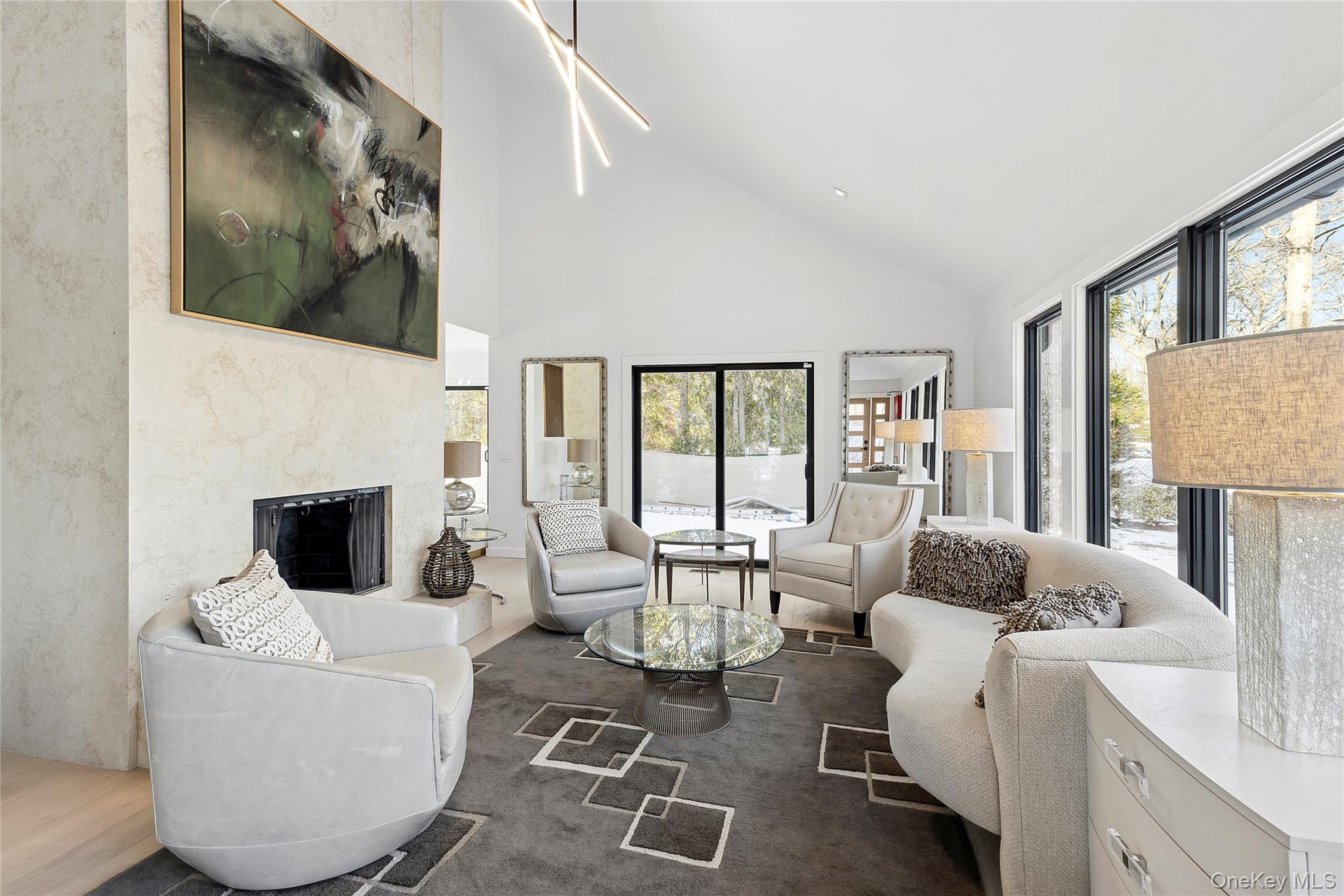 221 Redwood Road Sag Harbor, NY 11963 - Photo 4 of 19 a living room with furniture and a fireplace