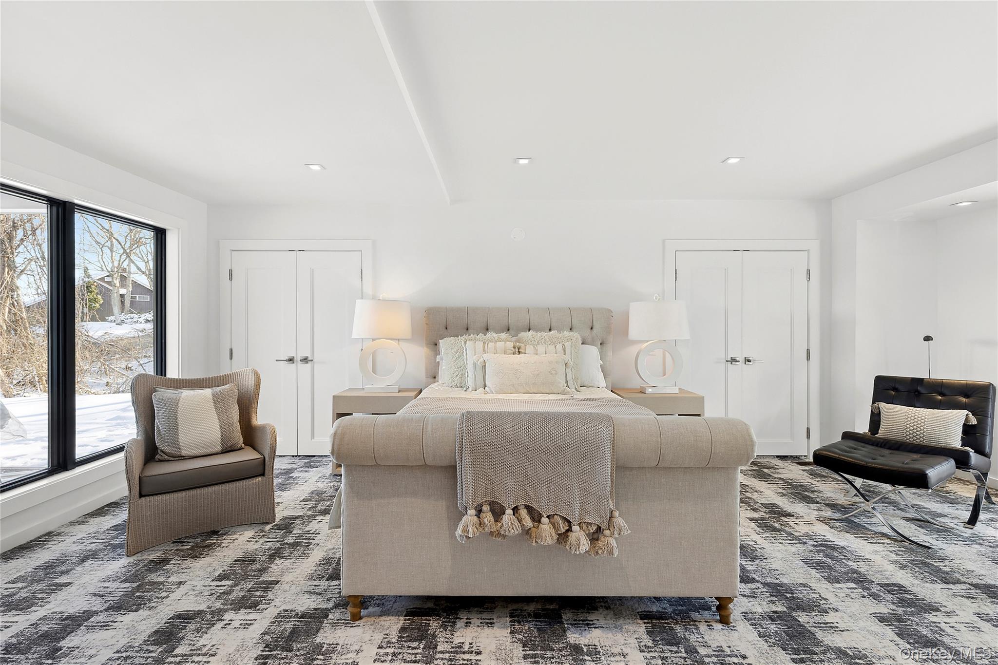 221 Redwood Road Sag Harbor, NY 11963 - Photo 10 of 19 a bedroom with furniture and wooden floor