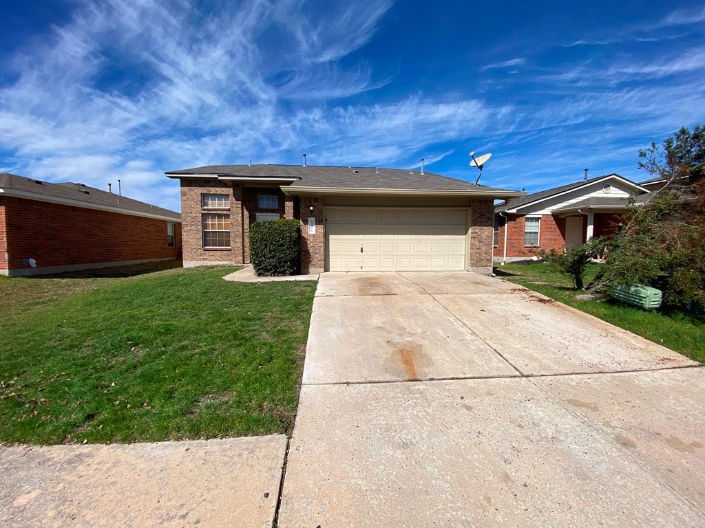 17416 Wiseman Drive Pflugerville, TX 78660 - Photo 1 of 1 a view of a yard with garage