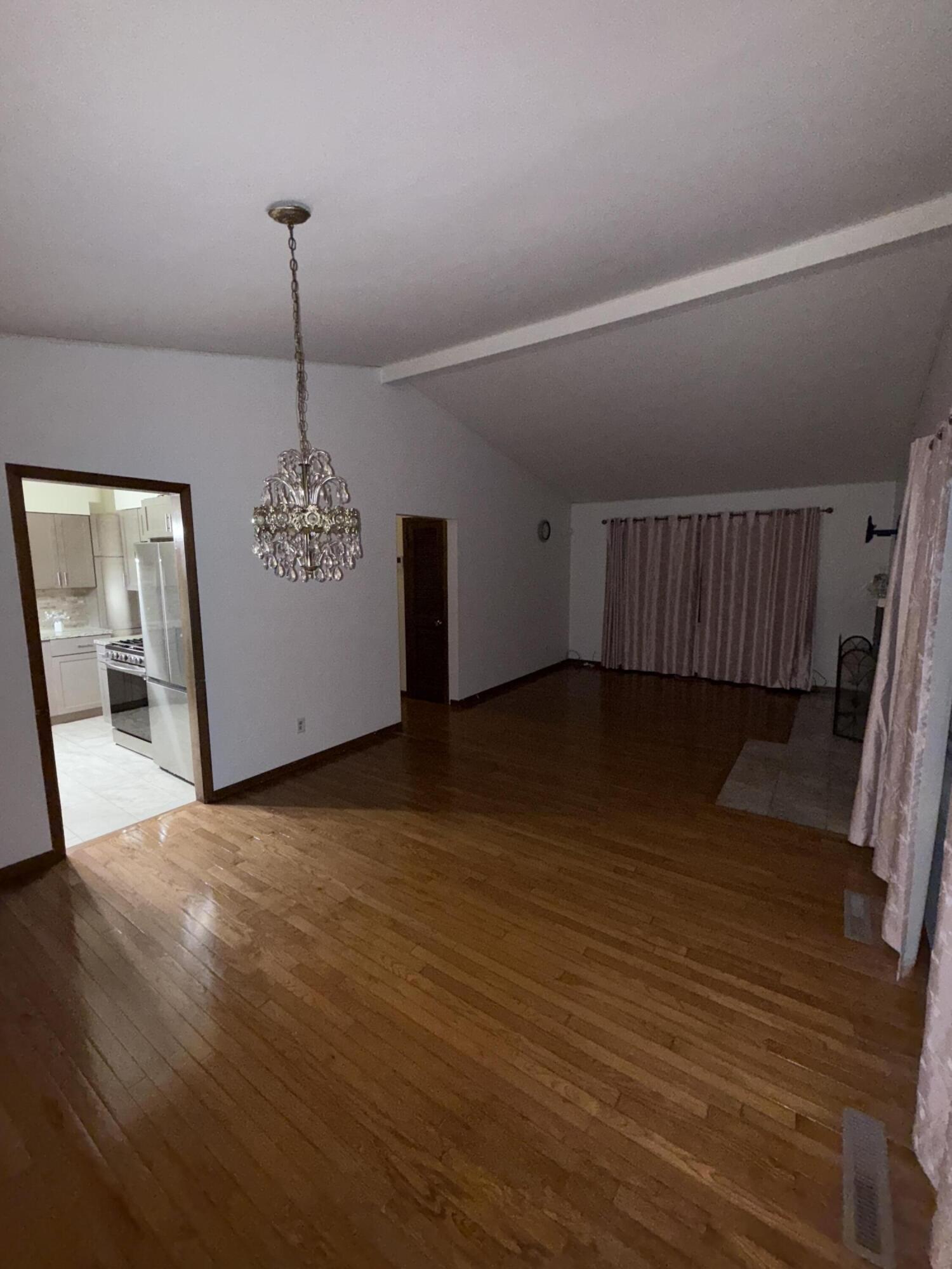 7809 Indian Boundary Gary, IN 46403 - Photo 2 of 13 a view of a livingroom with a furniture wooden floor and window