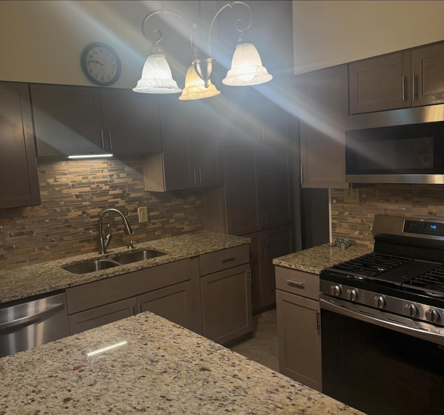 7809 Indian Boundary Gary, IN 46403 - Photo 3 of 13 a kitchen with kitchen island granite countertop a sink stainless steel appliances and cabinets