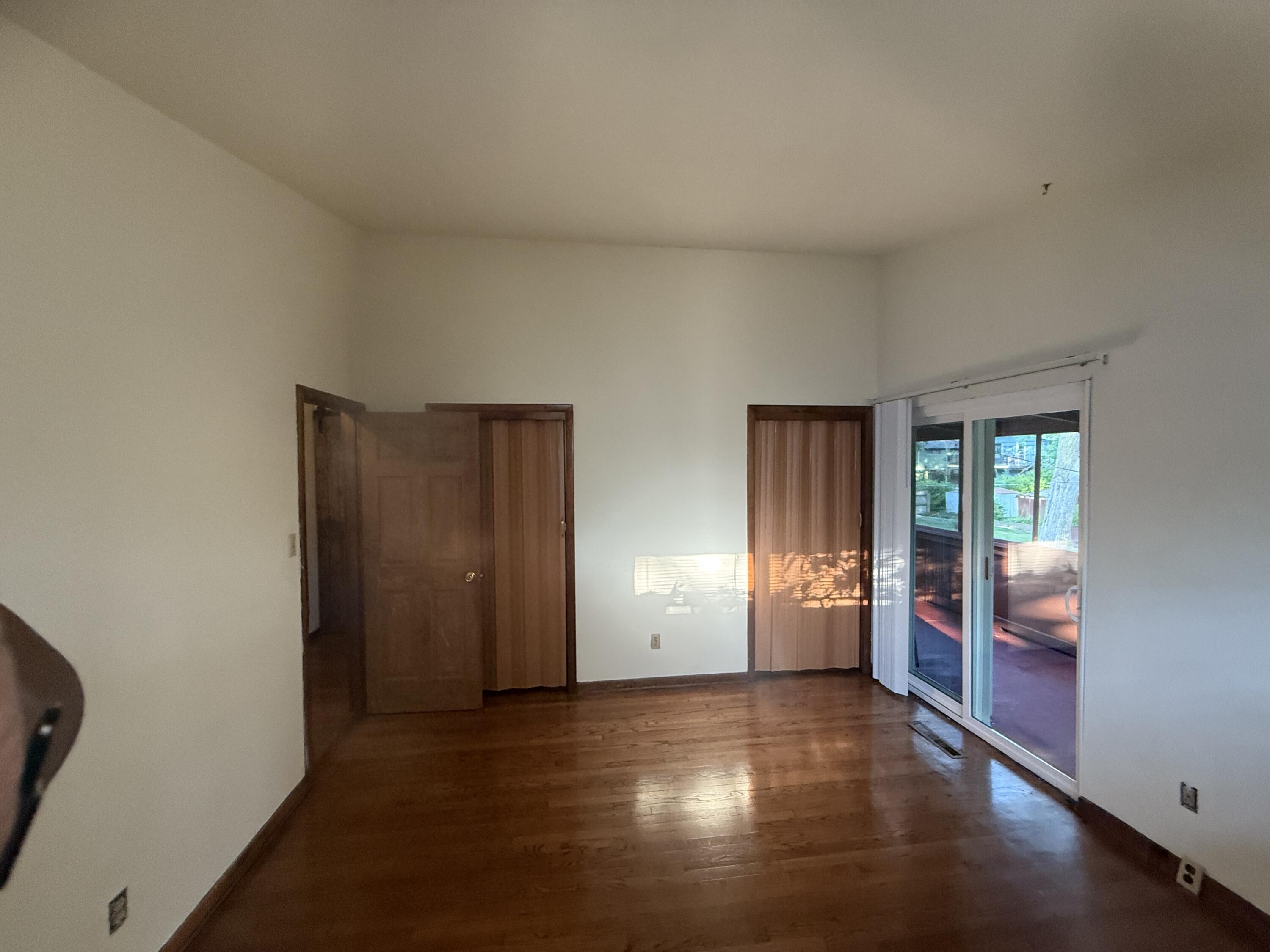 7809 Indian Boundary Gary, IN 46403 - Photo 5 of 13 an empty room with windows and cabinet
