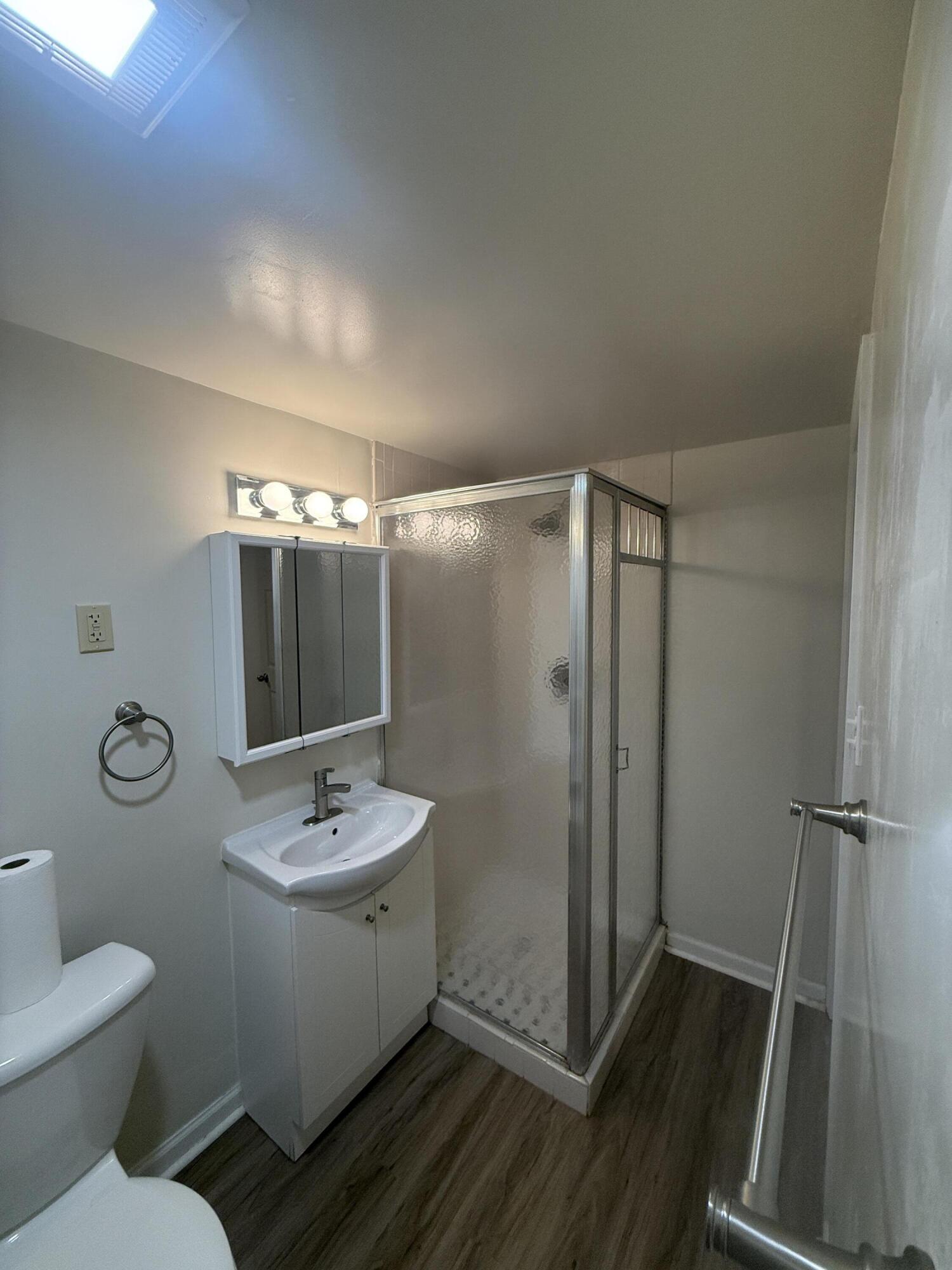 7809 Indian Boundary Gary, IN 46403 - Photo 10 of 13 a bathroom with a granite countertop sink toilet and shower