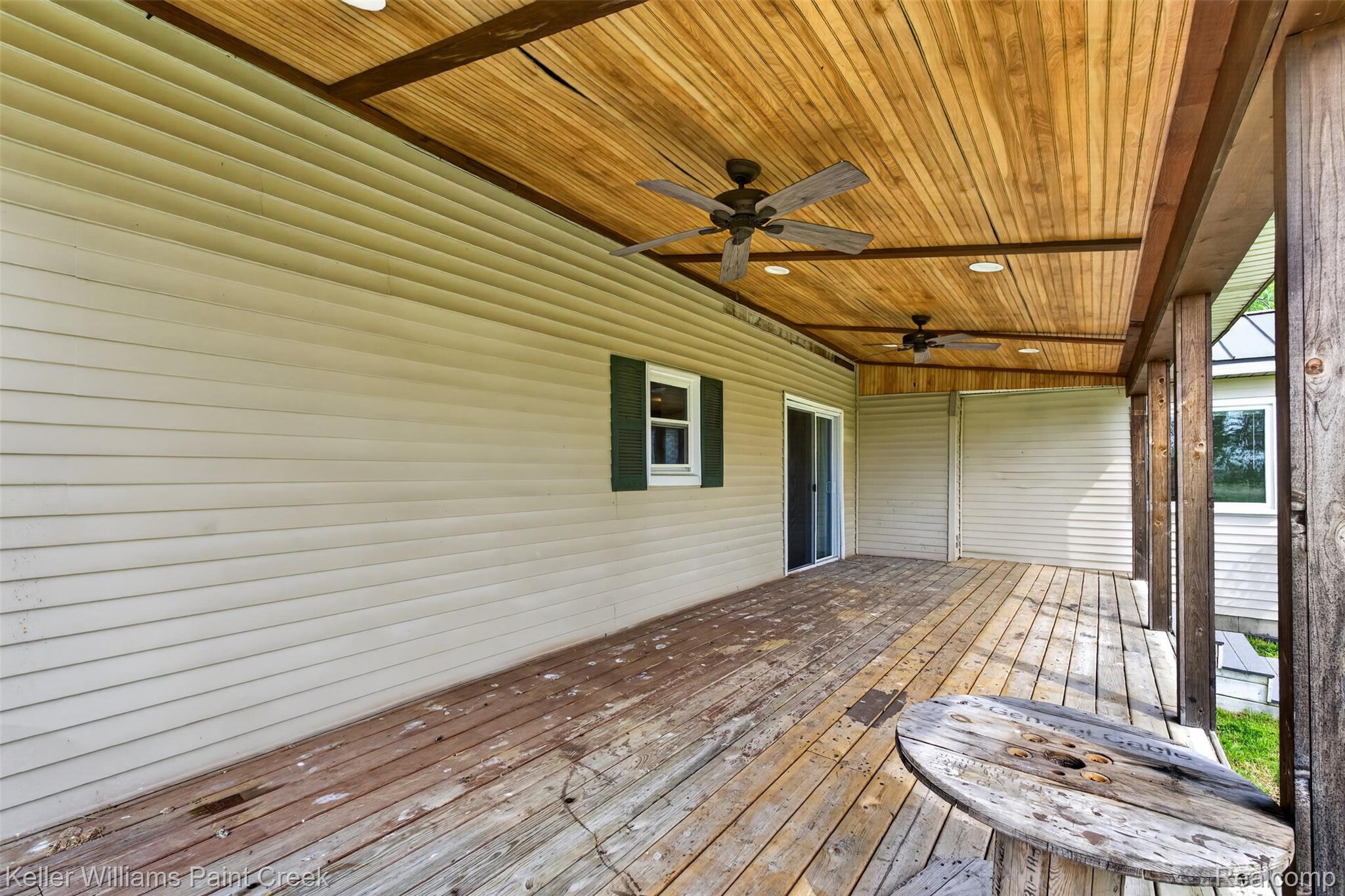 18125 Nelson Road St. Charles, MI 48655 - Photo 40 of 63 Wooden deck with a ceiling fan