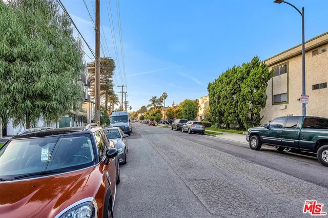 a view of a street with cars