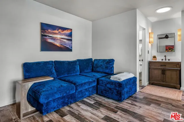 a living room with a couch and cabinets