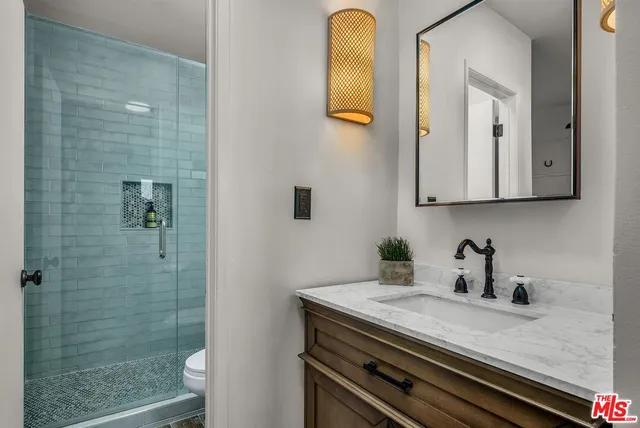 a view of bathroom with dual sinks