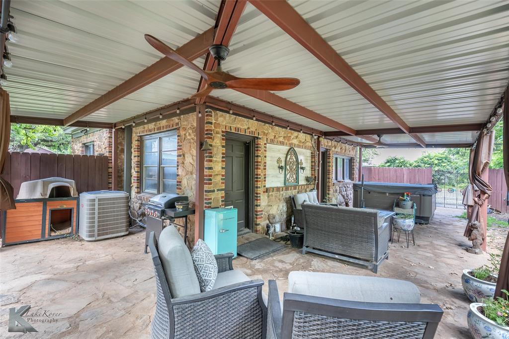202 East Ross Street Rising Star, TX 76471 - Photo 30 of 40 a view of a patio with couches table and chairs and potted plants