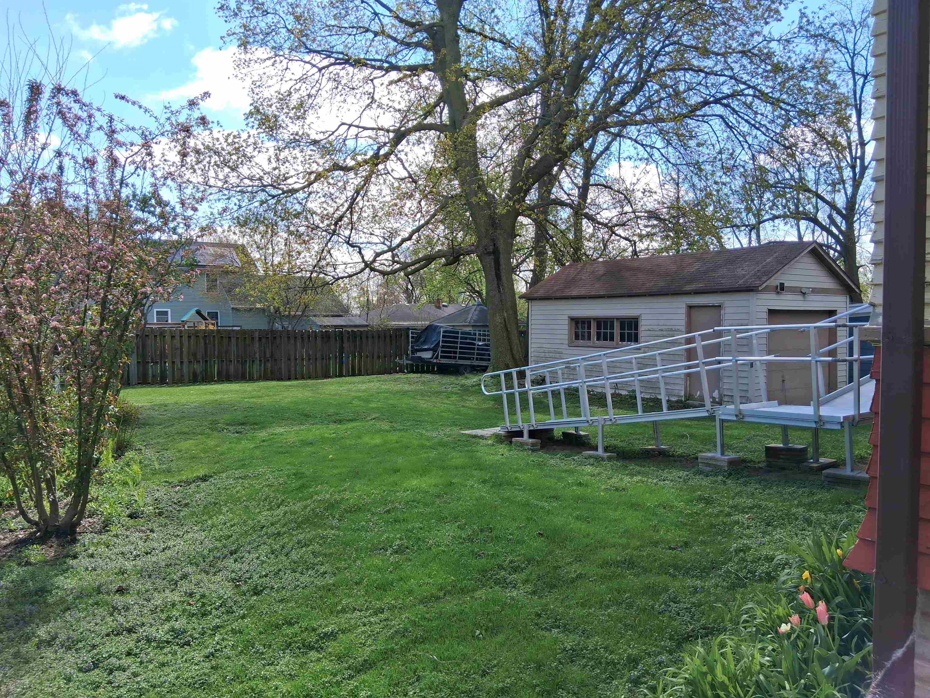 906 Somonauk Street Sycamore, IL 60178 - Photo 45 of 57 a view of a house with backyard and sitting area