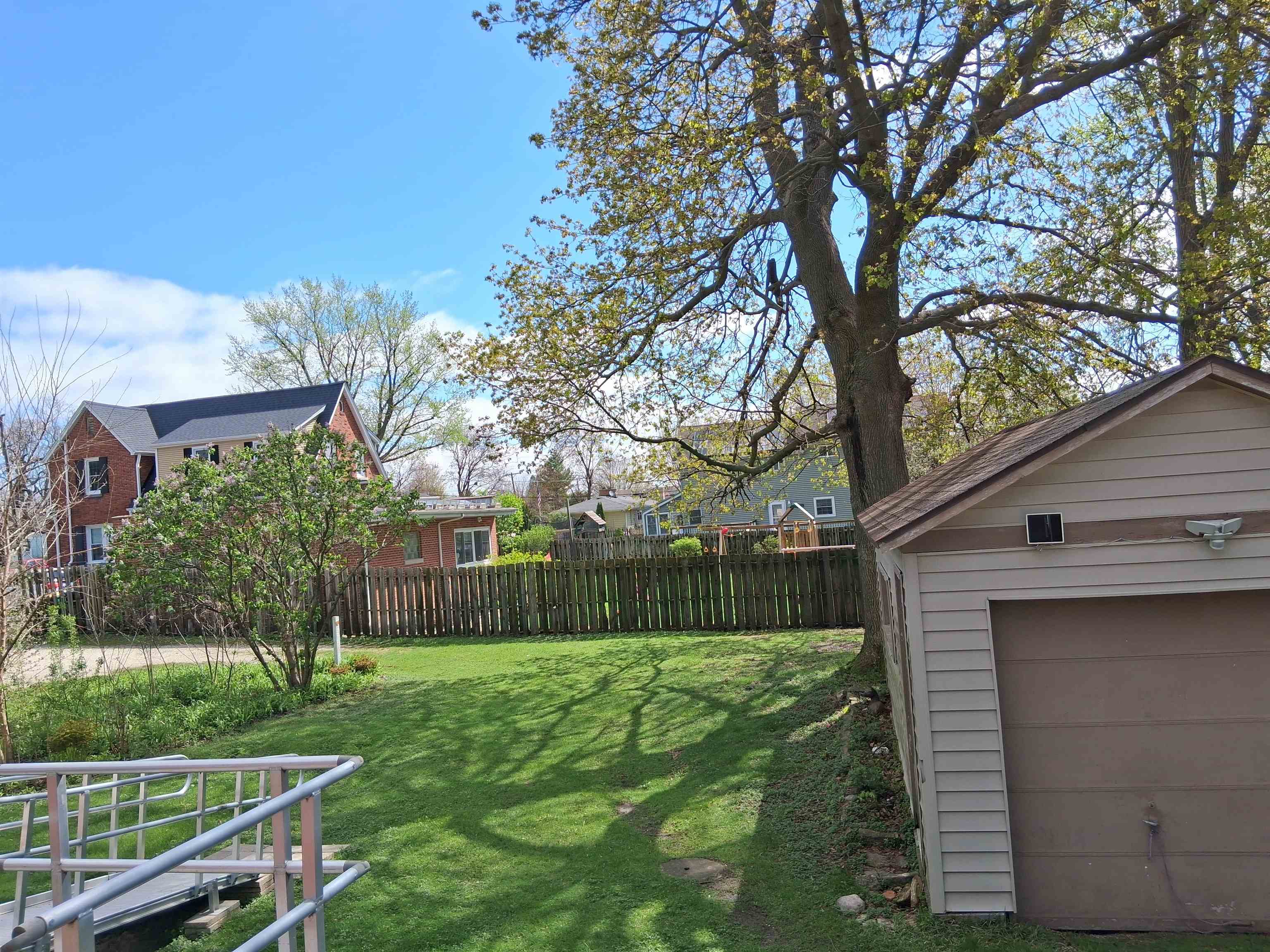 906 Somonauk Street Sycamore, IL 60178 - Photo 48 of 57 a view of a backyard with a large tree