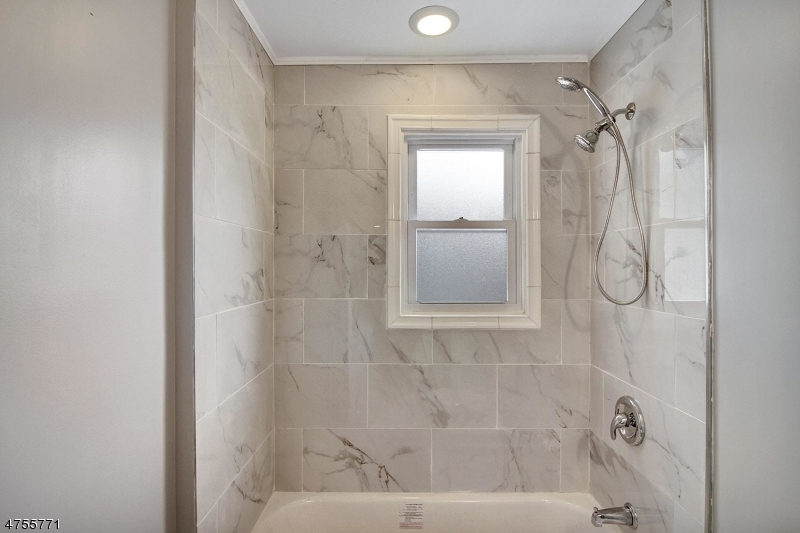 17 William Street, Unit B Summit, NJ 07901 - Photo 16 of 19 a bathroom with a glass shower door