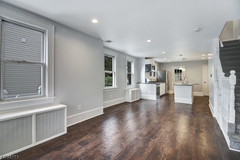 17 William Street, Unit B Summit, NJ 07901 - Photo 3 of 19 a view of a kitchen with wooden floor and a window