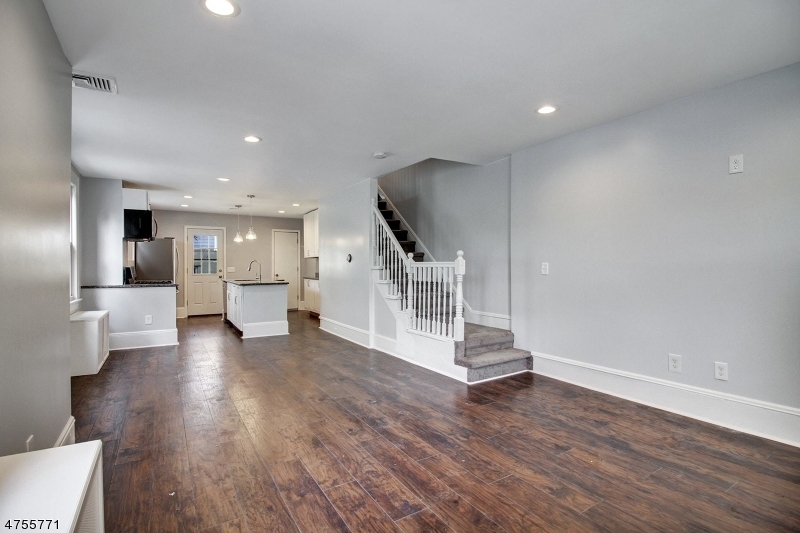 17 William Street, Unit B Summit, NJ 07901 - Photo 4 of 19 a view of a living room with wooden floor and a large window