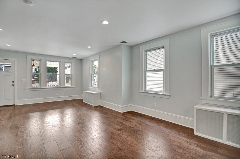 17 William Street, Unit B Summit, NJ 07901 - Photo 5 of 19 a view of an empty room with wooden floor and a window