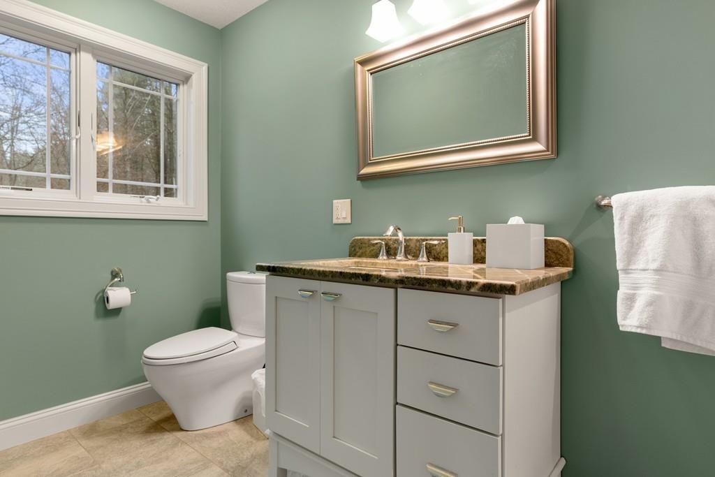286 Big Alum Road Sturbridge, MA 01518 - Photo 32 of 42 a bathroom with a granite countertop toilet sink and mirror