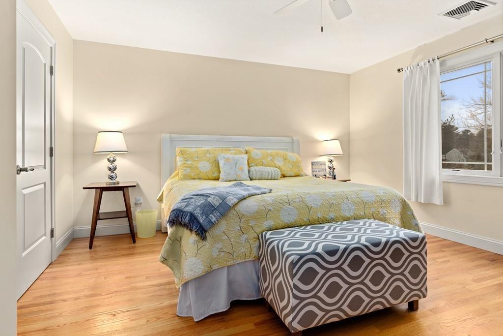 286 Big Alum Road Sturbridge, MA 01518 - Photo 33 of 42 a bedroom with a bed and wooden floor