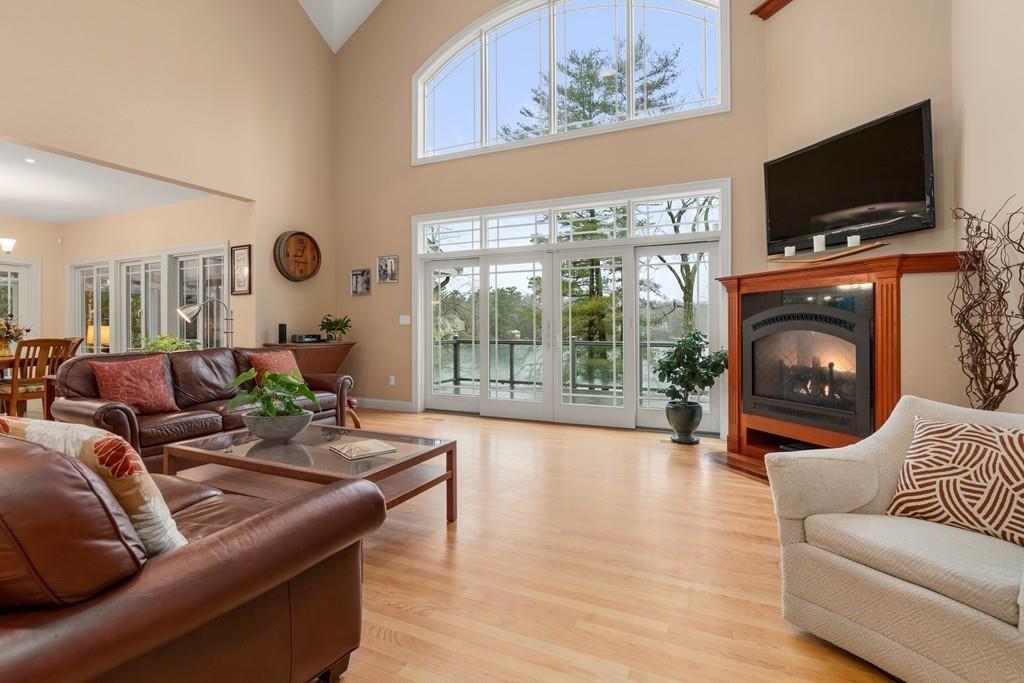 286 Big Alum Road Sturbridge, MA 01518 - Photo 8 of 42 a living room with furniture a flat screen tv and a fireplace