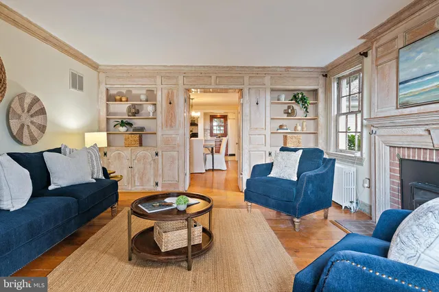 an empty room with a window and wooden floor