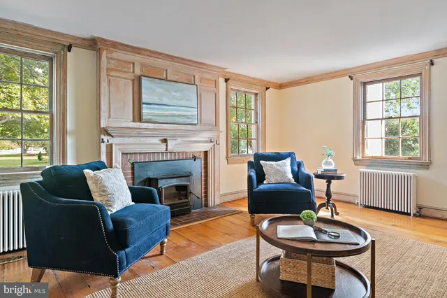 a workspace with furniture window and wooden floor