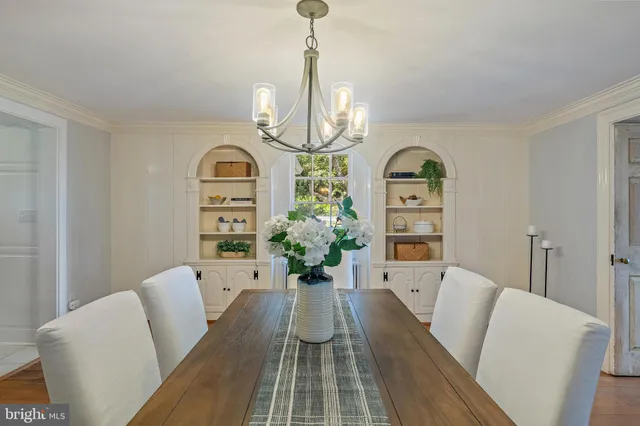 a reading room with furniture and a fireplace
