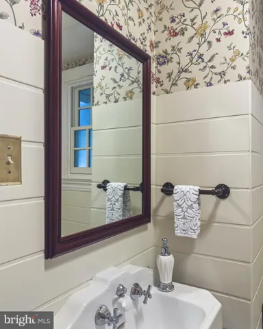 a view of a two chair and fire pit in the yard