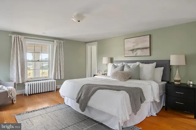 an aerial view of a house with a yard and lake view