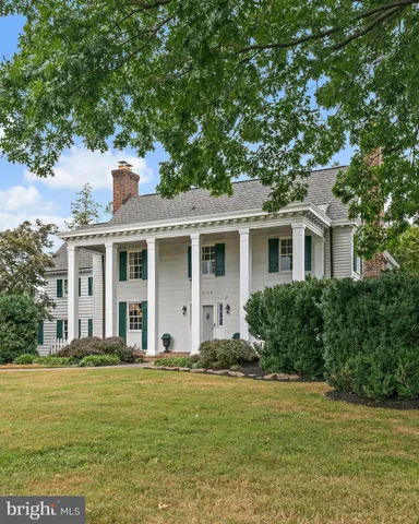 an outdoor view with swimming pool and outdoor seating