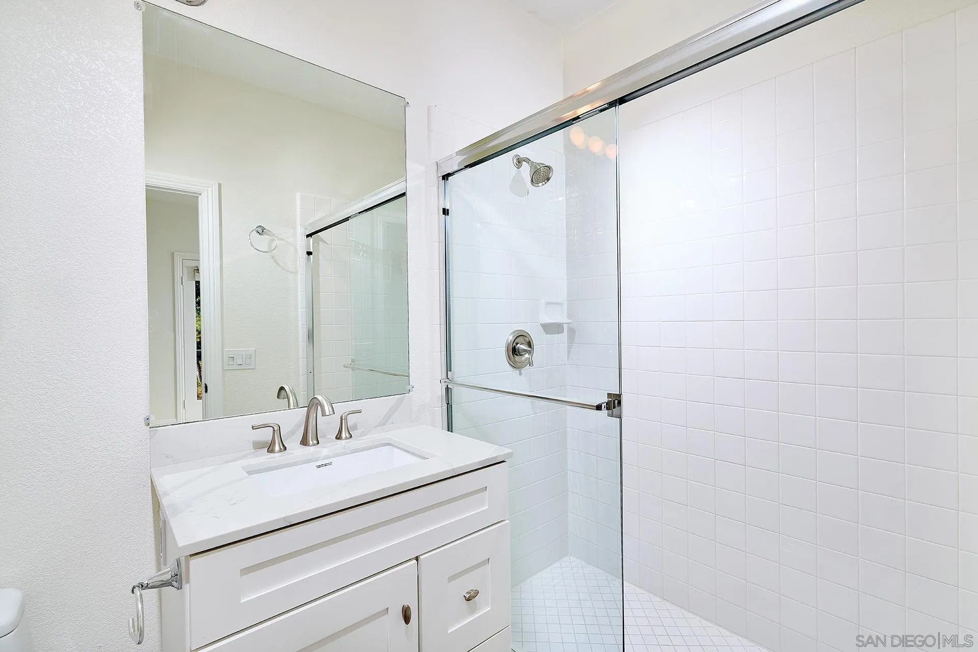 1664 Aryana Drive Encinitas, CA 92024 - Photo 20 of 38 a bathroom with a sink and mirror