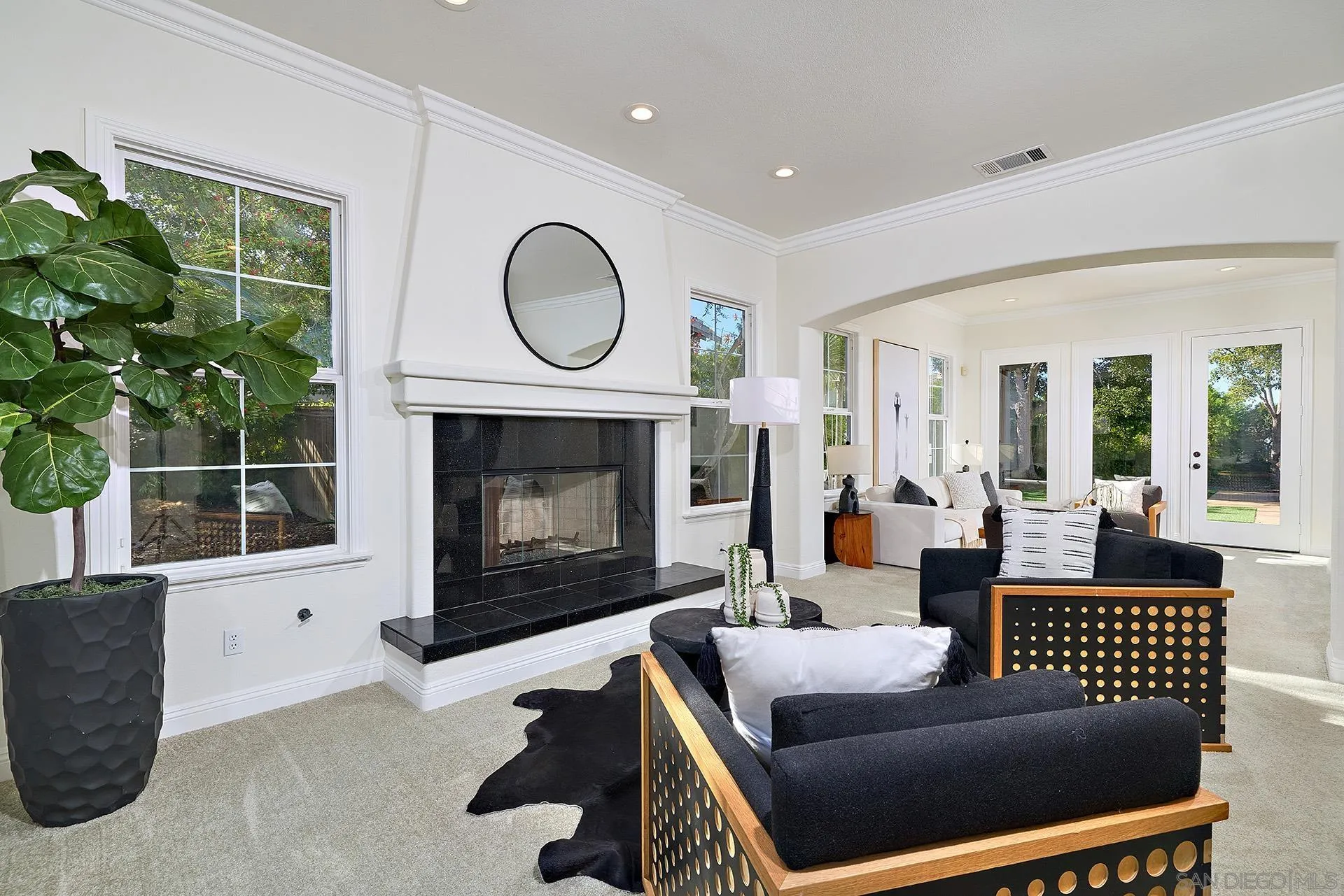 1664 Aryana Drive Encinitas, CA 92024 - Photo 5 of 38 a living room with furniture a window and a fireplace