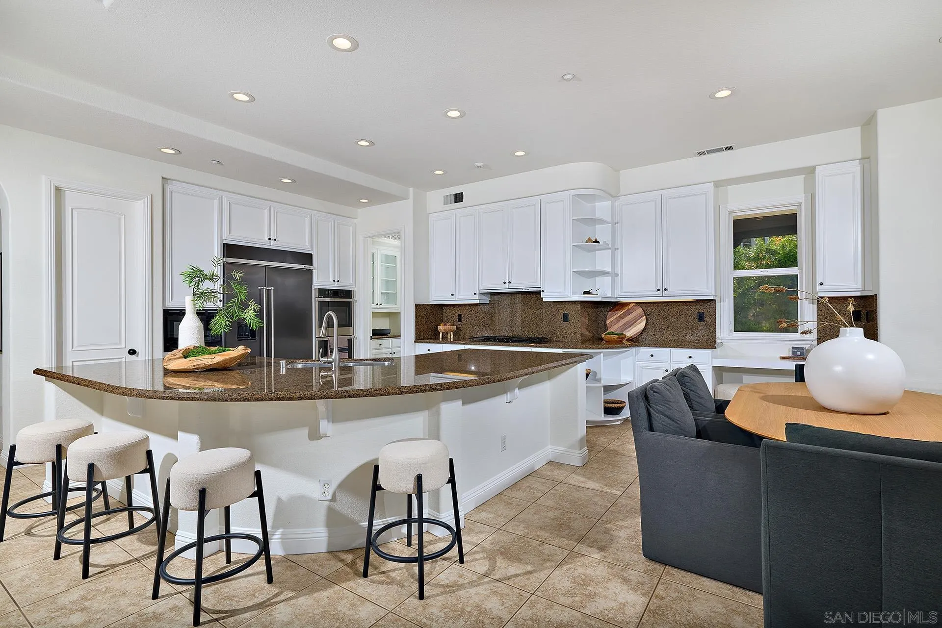 1664 Aryana Drive Encinitas, CA 92024 - Photo 7 of 38 a large kitchen with a table and chairs