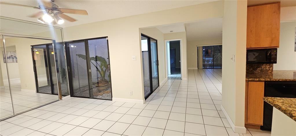 814 Northwest 79th Terrace, Unit 814 Plantation, FL 33324 - Photo 4 of 21 a view of hallway with chandelier and a refrigerator