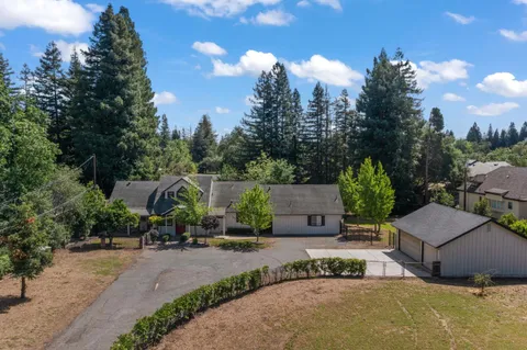 an aerial view of a houses with outdoor space and street view