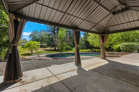 a backyard of a house with a yard and lake