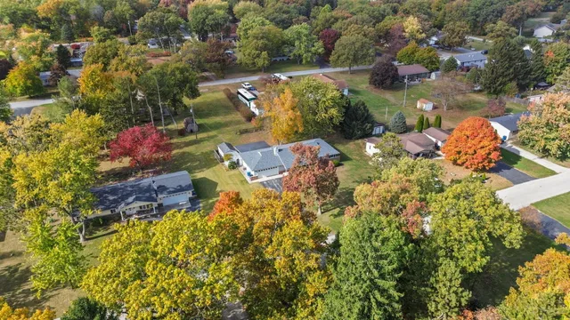 an aerial view of a house with a yard