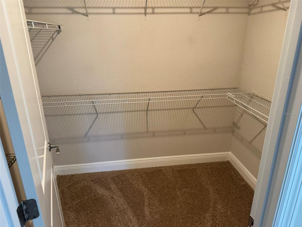 2420 Ann Rou Road, Unit 201 Tavares, FL 32778 - Photo 15 of 25 a view of a room with racks on the wall