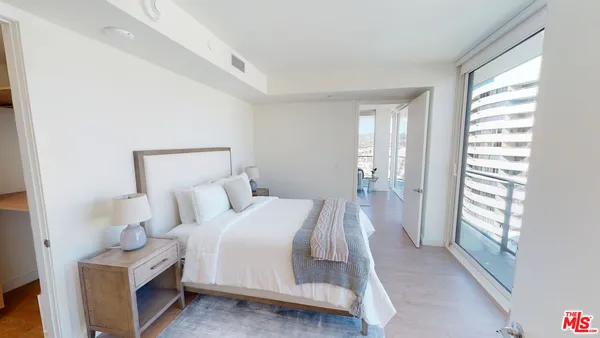 a bed room with a bed and a window