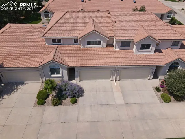 an aerial view of residential house with outdoor space