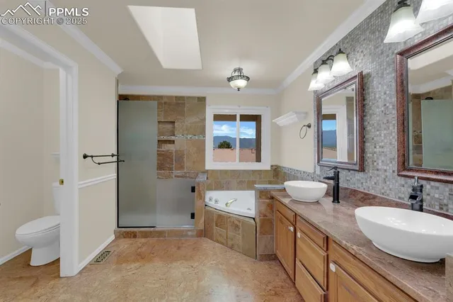 a bathroom with a granite countertop sink mirror and a bathtub