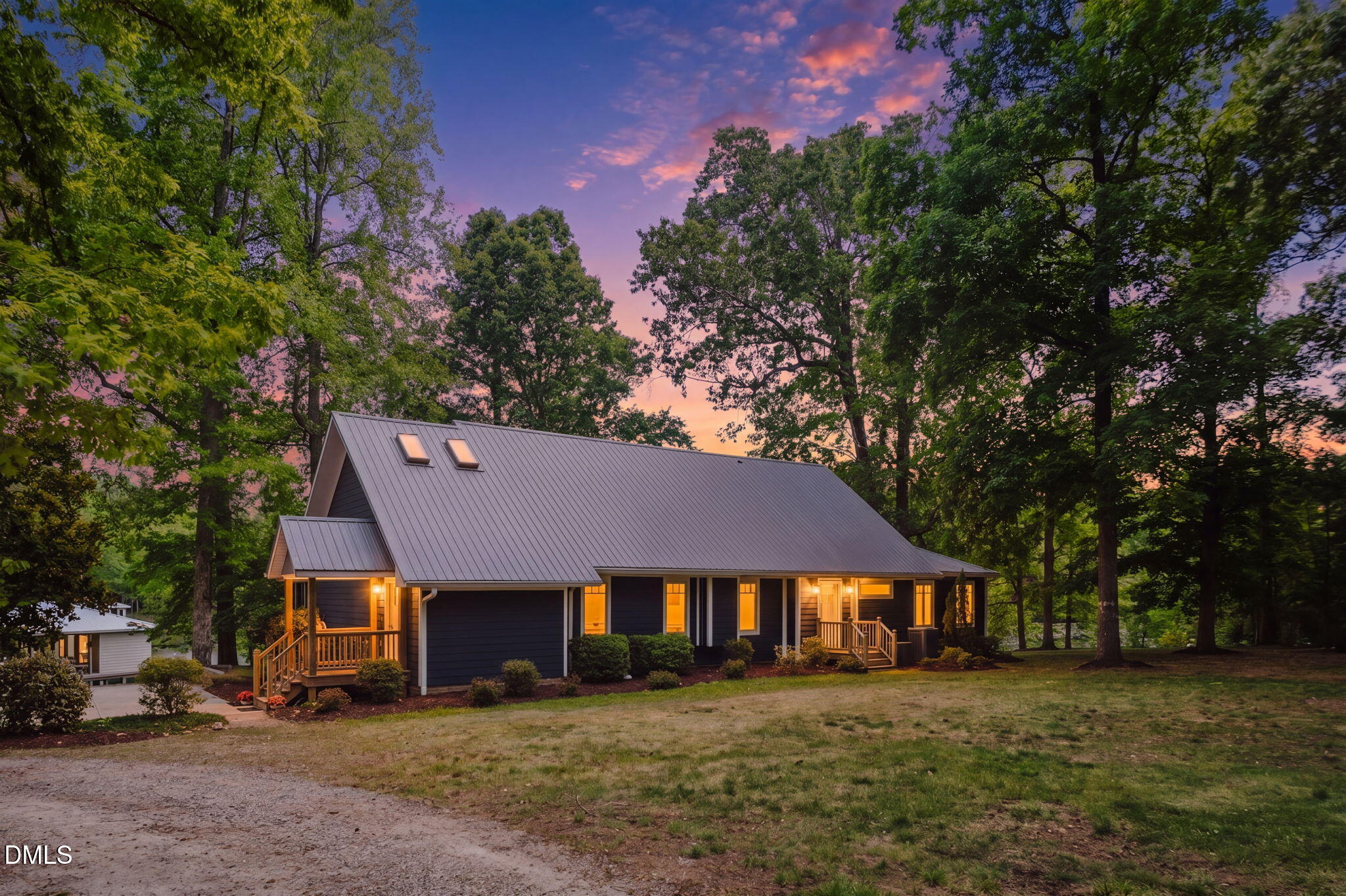 370 Robinson Ferry Road Macon, NC 27551 - Photo 78 of 85 a front view of a house with a garden