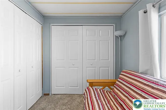 a bedroom with bed and balcony