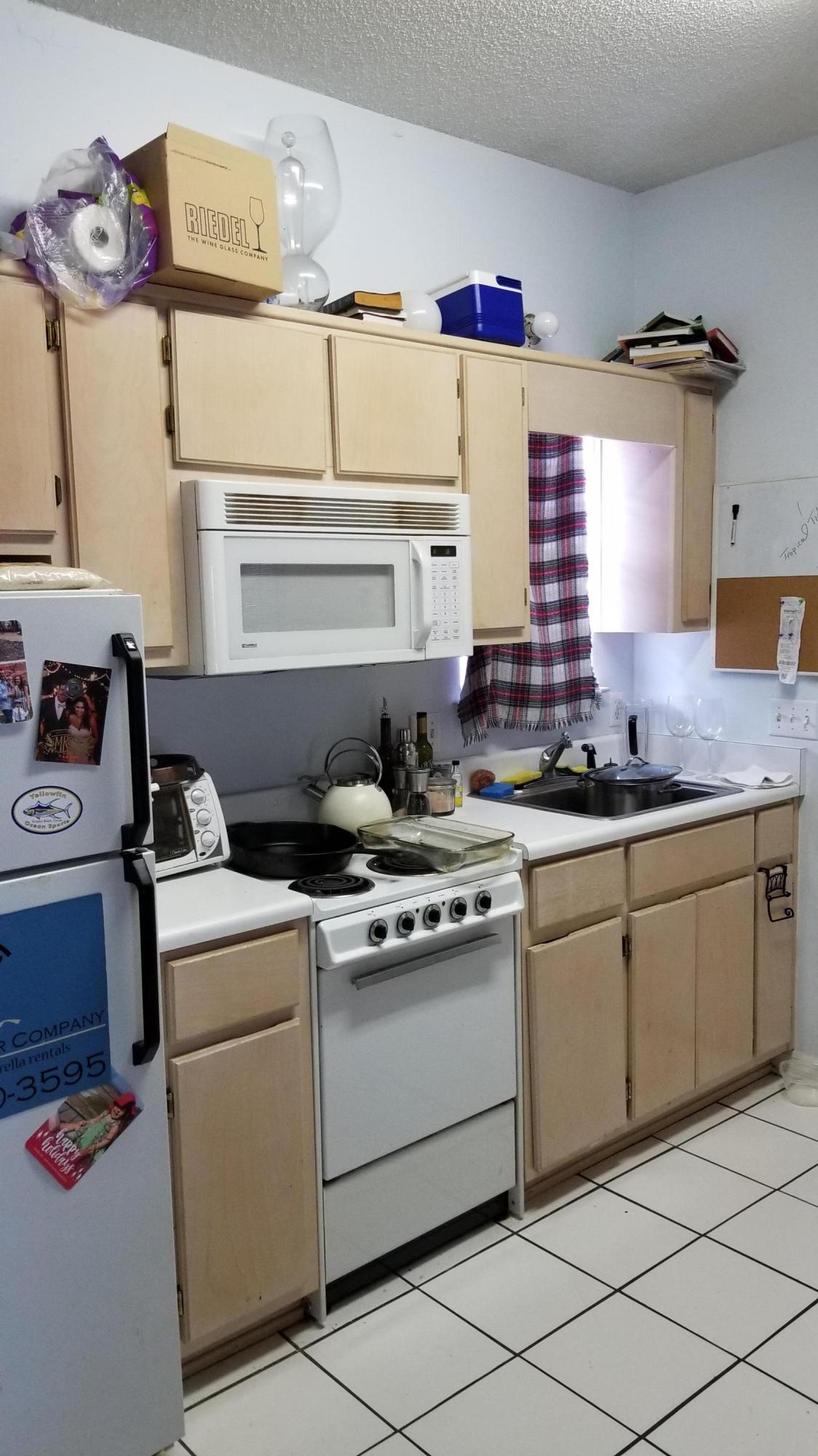 92 Bramble Street, Unit 92 Santa Rosa Beach, FL 32459 - Photo 10 of 14 a kitchen with a stove cabinets and window