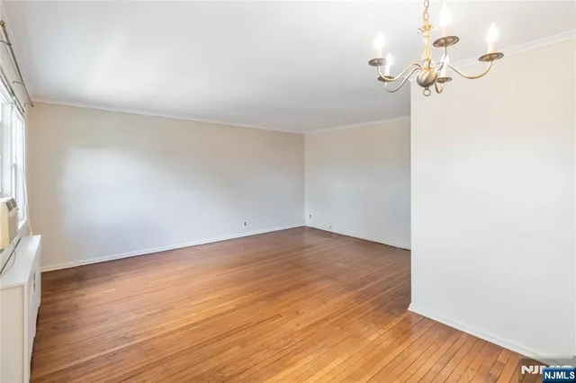 a kitchen with stainless steel appliances granite countertop a refrigerator and a stove
