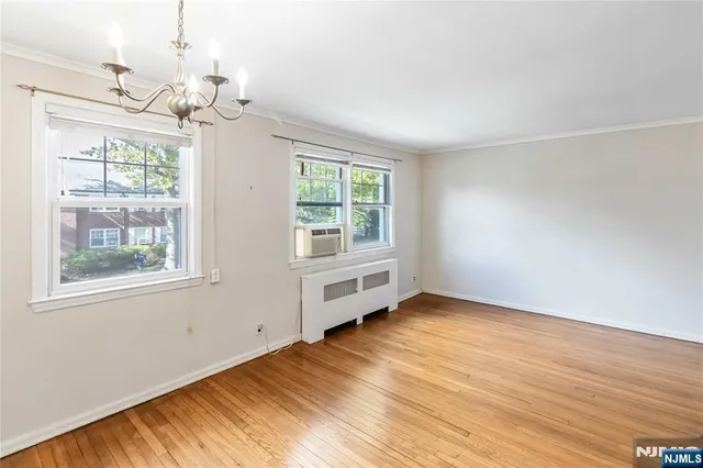 a kitchen with wooden floor and a stove