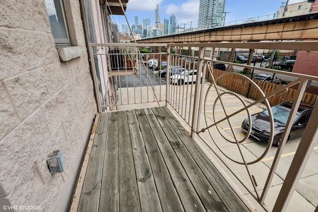 a view of balcony with wooden floor
