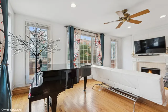 a living room with furniture fireplace and flat screen tv