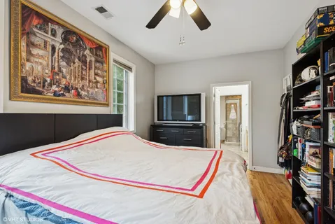 a bed room with a bed and a television