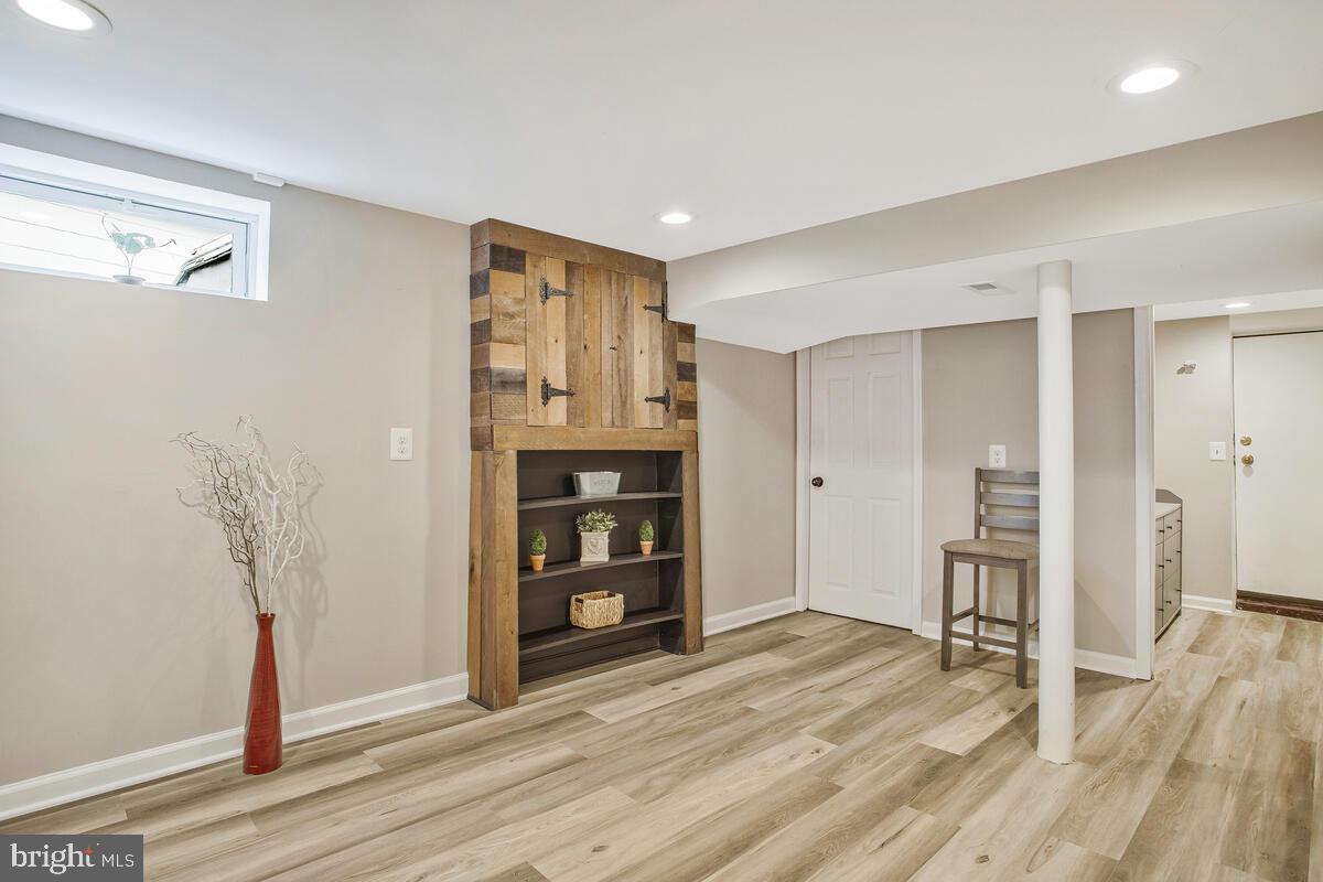 71 Del Rio Road Dundalk, MD 21222 - Photo 23 of 37 a view of a kitchen with wooden floor and a refrigerator