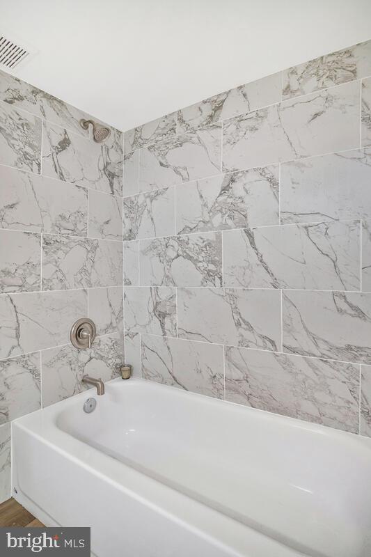 71 Del Rio Road Dundalk, MD 21222 - Photo 30 of 37 a bathroom with a bathtub