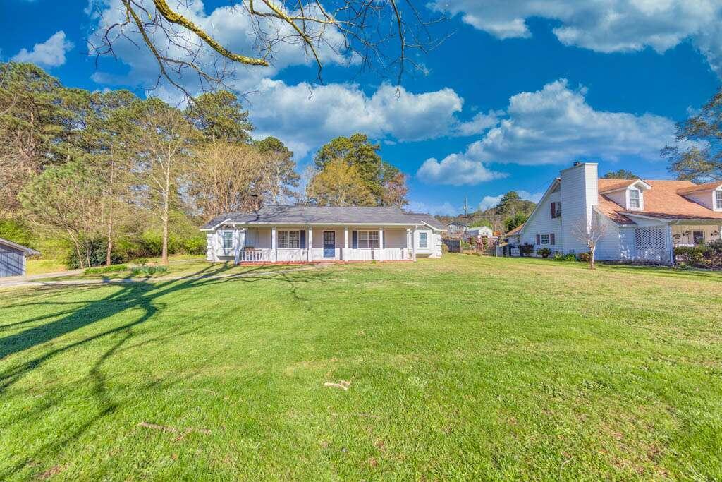 a view of a house with a big yard